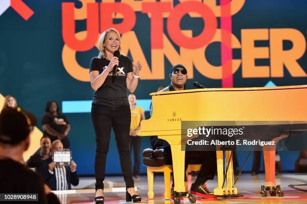 Katie Couric and Stevie Wonder perform onstage at the sixth biennial Stand Up To Cancer telecast at the Barkar Hangar on Friday, September 7, 2018 in...