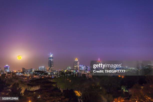 moon rising over sandton city in the evening - sandton cbd stock pictures, royalty-free photos & images