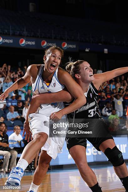 Christi Thomas of the Chicago Sky battles for position with Jayne Appel of the San Antonio Silver Stars during the WNBA game on July 14, 2010 at the...