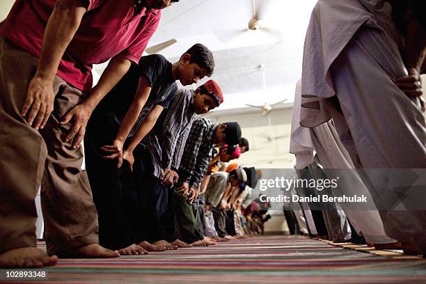 Members of the persecuted Ahmadiyya community pray in a mosque on July 14, 2010 in Chenab Nagar, Pakistan. The Pakistani Ahmadis, define themselves...