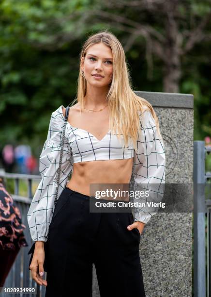 Model wearing white cropped top is seen outside Cushnie et Ochs during New York Fashion Week Spring/Summer 2019 on September 7, 2018 in New York City.