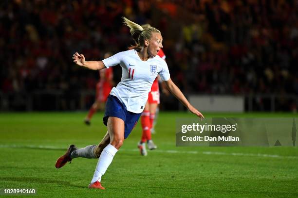 Toni Duggan of England celebrates scoring the first goal during the Women's World Cup qualifier between Wales Women and England Women at Rodney...