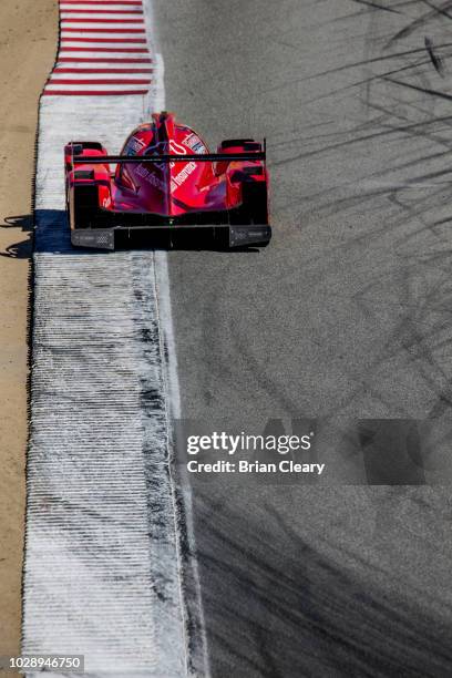 The ORECA LMP2 of Misha Goikhberg, of Russia, and Stephen Simpson, of South Africa, races on the track during practice for the America Tires 250 IMSA...