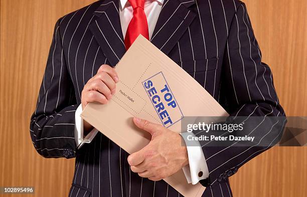 secret agent spy with top secret file - funcionário público imagens e fotografias de stock