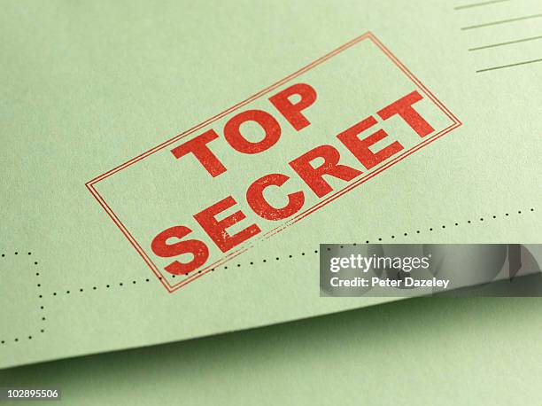 top secret folder file - surveillance fotografías e imágenes de stock