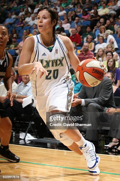 Nuria Martinez of the Minnesota Lynx moves the ball against the San Antonio Silver Stars during the game on July 8, 2010 at the Target Center in...