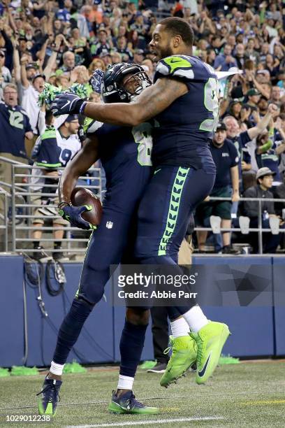 Malik Turner and Nazair Jones of the Seattle Seahawks celebrate a touchdown that would be called back against the Oakland Raiders in the third...