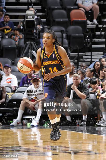 Tan White of the Connecticut Suns moves the ball against the San Antonio Silver Stars during the WNBA game on July 6, 2010 at the AT&T Center in San...