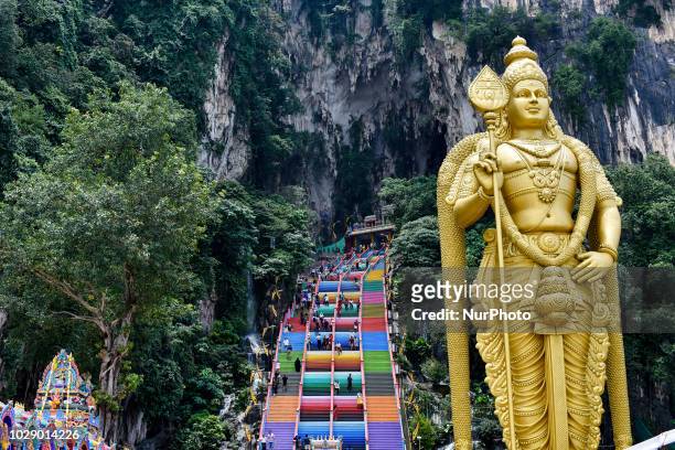 Tourists walk up the newly-painted 272-steps staircase leading to Malaysia Batu Caves and temple in Kuala Lumpur, Malaysia on September 03, 2018.