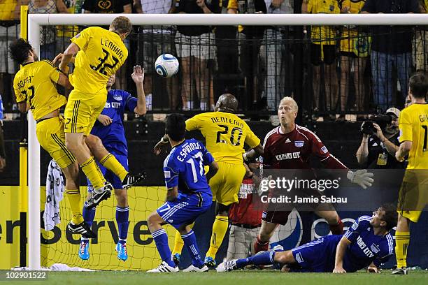 Adam Moffat of the Columbus Crew and Steven Lenhart of the Columbus Crew collide with each other as they direct the ball to goalkeeper Jimmy Nielsen...