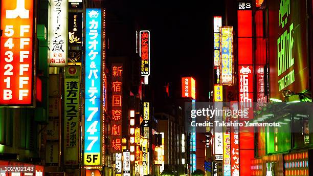 a neon signs in shinjuku, tokyo at night - shinjuku stock pictures, royalty-free photos & images
