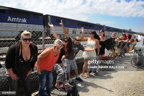Residents of Laguna Niguel expose their buttocks to a passing Amtrak train during the 31st annual "Mooning of the trains" event along a stretch of...