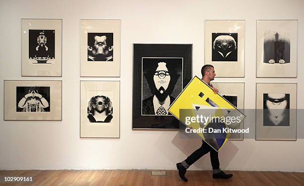 Curator David Crowley puts the finishing touches to an exhibition by Polish artist and graphic designer Roman Cieslewicz at the Royal Academy of Arts...