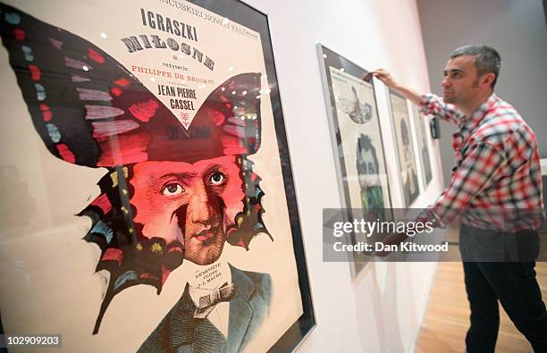 Curator David Crowley puts the finishing touches to a series of iconic prints by Polish artist and graphic designer Roman Cieslewicz at the Royal...