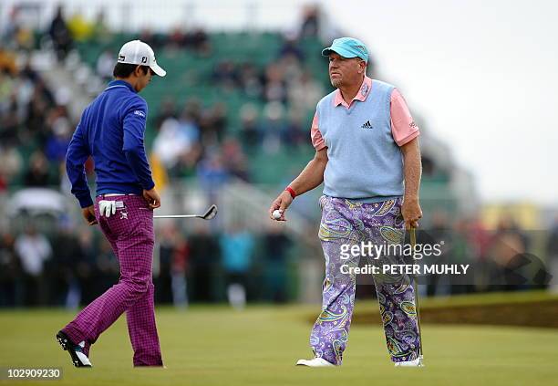 Golfer John Daly and Korean golfer Noh Seung-yul on the 14th Green during his opening round on the first day of the British Open Golf Championship at...