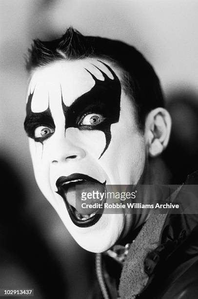 Singer Robbie Williams on the set of the video music shoot Let Me Entertain You by photographer Jamie Hughes in London in 1999.