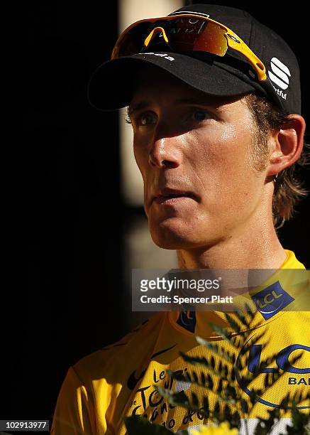 Luxembourg's Andy Schleck, wearing the race leaders the yellow jersey, stands on the podium after stage 11 of the Tour de France July 15, 2010 in...