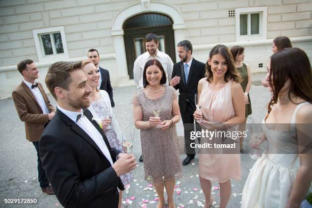 bride, groom and guests on a small wedding - wedding guests stock pictures, royalty-free photos & images