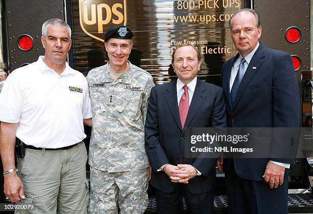 Retired SGT Joseph Bowser, Lieutenant General David Huntoon, Jr., NHL Commissioner Gary Bettman and president of UPS' East Region Glenn Rice attend...