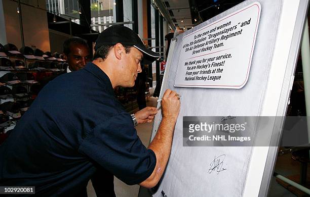 Hockey Hall of Fame NHL player Pat LaFontaine signs message board for the troops at NHL, UPS & U.S. Army Street Hockey Equipment Donation To Troops...