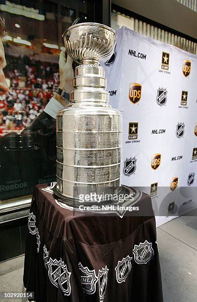 Fans view the Stanley Cup at the NHL, UPS & U.S. Army Street Hockey Equipment Donation To Troops In Iraq event at the NHL Powered by Reebok Store on...