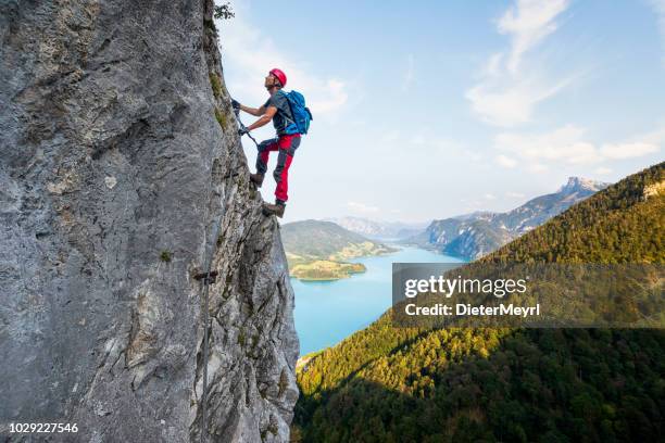 rock climbing in alps - salzkammergut stock pictures, royalty-free photos & images