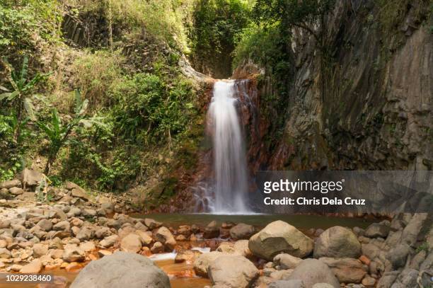 pulang bato falls in valencia, negros oriental - negros_(philippines) stock pictures, royalty-free photos & images
