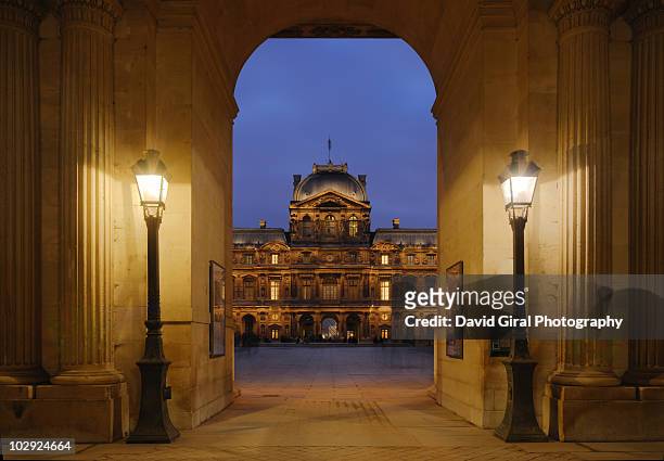 the entrance  at night - louvre paris stock pictures, royalty-free photos & images