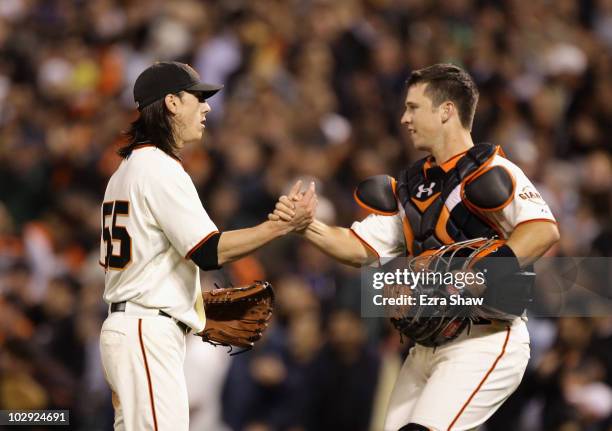 Tim Lincecum of the San Francisco Giants is congratulated by Buster Posey after Lincecum pitched a complete game shut out against the New York Mets...