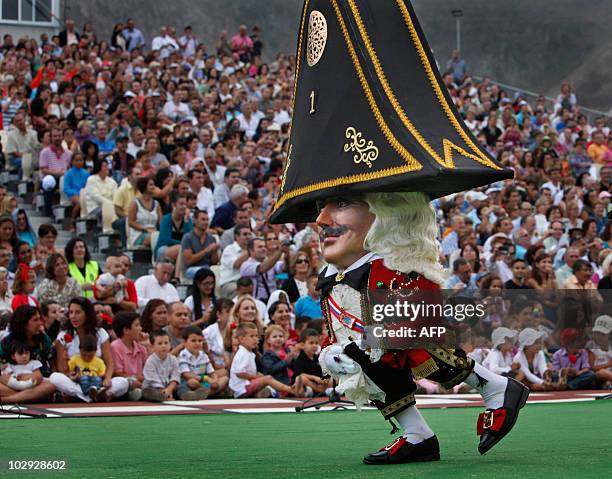 Midget dances during the "Dance of the Midgets" of the 67th descent of the Virgin of the Snows in Santa Cruz de La Palma, on the Spanish Canary...