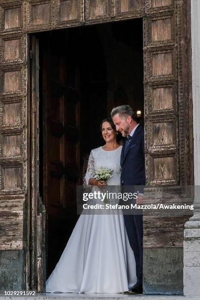 Luxembourg-born actress Desiree Nosbusch, wearing a dress by MINX, and German cameraman Tom Alexander Bierbaumer exit from the church of Oderzo after...