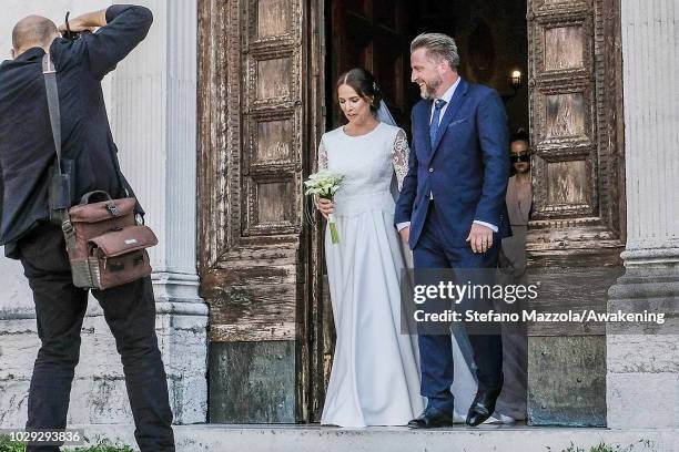 Luxembourg-born actress Desiree Nosbusch, wearing a dress by MINX, and German cameraman Tom Alexander Bierbaumer exit from the church of Oderzo after...