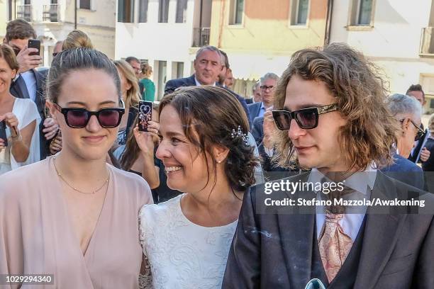 Luxembourg-born actress Desiree Nosbusch poses with her children after exiting the church of Oderzo following her marriage to German cameraman Tom...