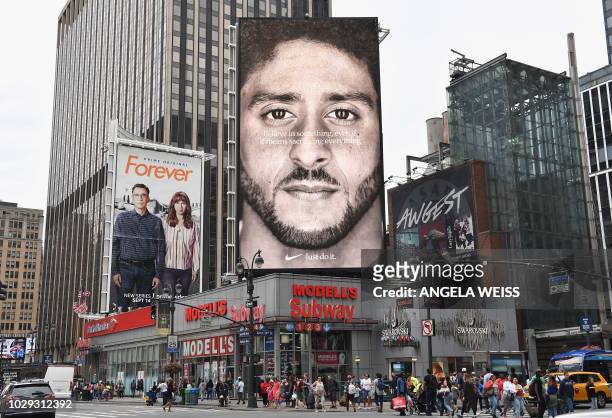 Nike Ad featuring American football quarterback Colin Kaepernick is on diplay September 8, 2018 in New York City. Nike's new ad campaign featuring...