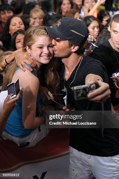 Singer Enrique Iglesias kisses fan Nicolette Benderoth during his performance on NBC's "Today" at Rockefeller Center on July 16, 2010 in New York...