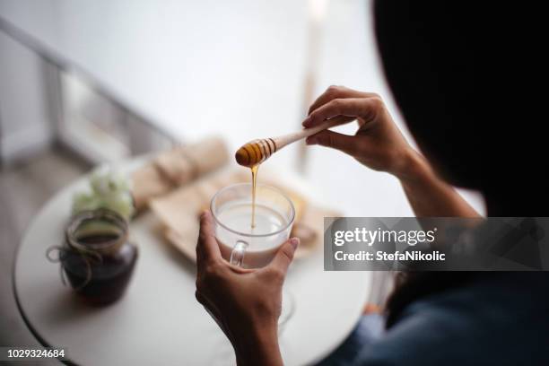 woman preparing healthy breakfast at home - honey jar stock pictures, royalty-free photos & images