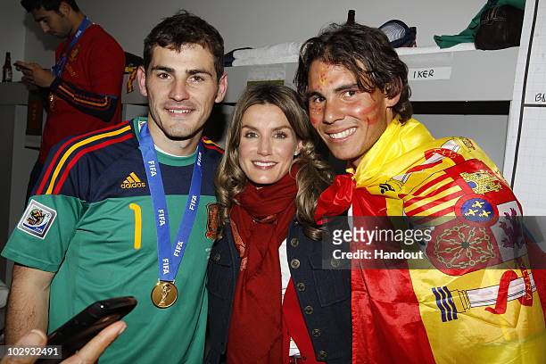 Spain´s goalkeeper Iker Casillas , Spanish Princess Letizia and tennis player Rafa Nadal celebrates the victory in the Spanish dressing room after...