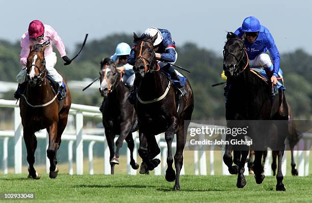 Al Aasifh ridden by jockey Frankie Dettori goes on to win The Rose Bowl Stakes from Sir Reginald ridden by jockey Kieren Fallon and Cape To Rio...