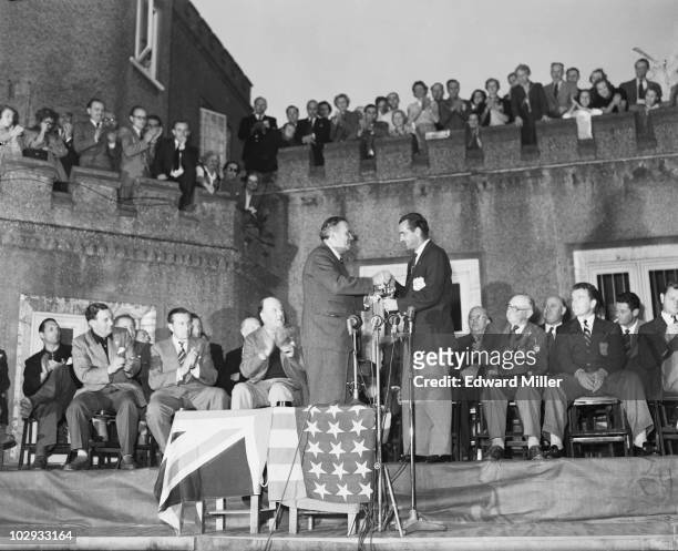 Sir Leonard Lyle, Baron Lyle of Westbourne presents the Ryder Cup to American Golf captain Lloyd Mangrum of the USA, at the Wentworth Club, Surrey,...