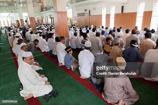 Members of the persecuted Ahmadiyya community attend Friday prayers at the Garhi Shahu mosque on July 16, 2010 in Lahore, Pakistan. The Pakistani...