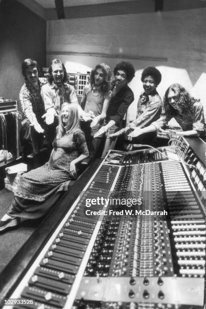 Portrait of, standing from left, American studio manager Jim Marron, South African-born American music producer and engineer Eddie Kramer, English...