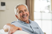 Senior man smiling at home