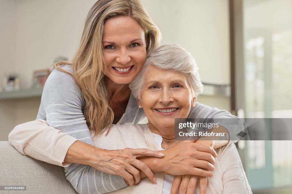 Woman hugging mother with love