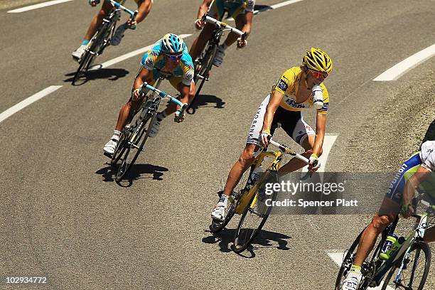 Luxembourg's Andy Schleck, in the yellow jersey, rides with the main group along stage 12 of the Tour de France July 16, 2010 in Mende, France. The...