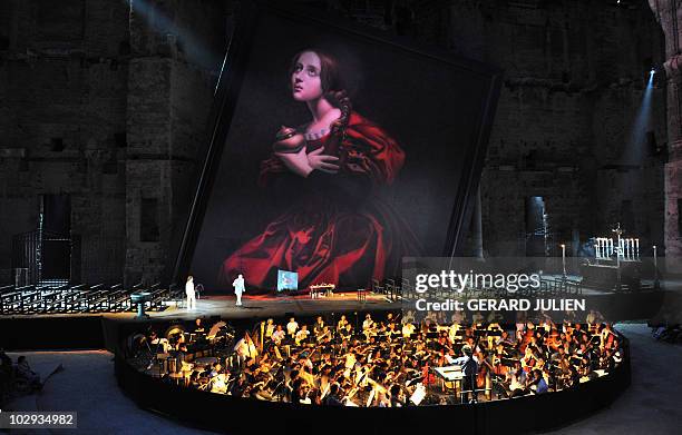 Actors perform during the rehearsal of Italian Giacomo Puccini opera "Tosca" on July 13 in Orange, southern France, during the Choregies d'Orange, a...