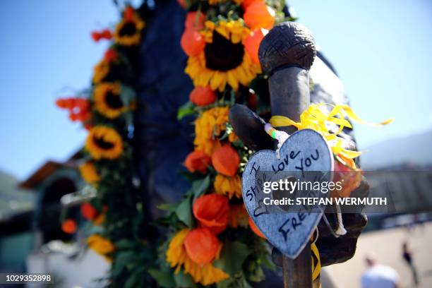 Message is hanged on a statue of Queen's late singer Freddie Mercury on September 8, 2018 in Montreux, as fans gather like every year to celebrate...