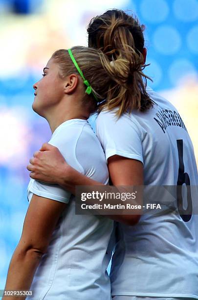 Bridgette Armstrong of New Zealand comforts team mate Rosie White during the 2010 FIFA Women's World Cup Group B match between North Korea and New...