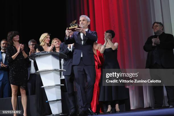 Alfonso Cuaron receives the Golden Lion for Best Film Award for 'Roma' at the Award Ceremony during the 75th Venice Film Festival at Sala Grande on...