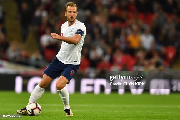 England's striker Harry Kane looks to pass the ball during the UEFA Nations League football match between England and Spain at Wembley Stadium in...