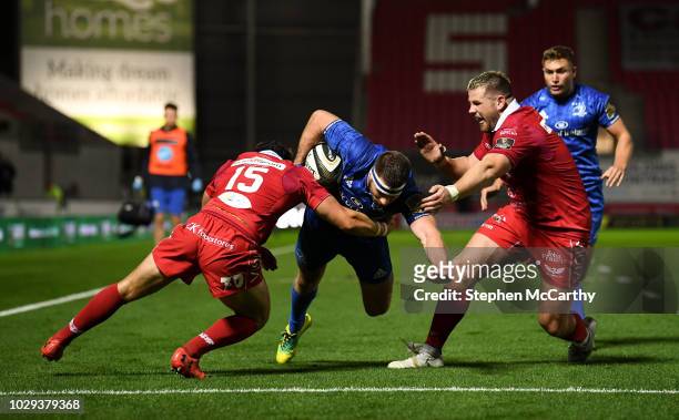 Llanelli , United Kingdom - 8 September 2018; Fergus McFadden of Leinster goes over to score his side's first try despite the tackle of Leigh...